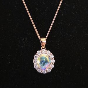 Elegant Gold Necklace with Iridescent Pendant